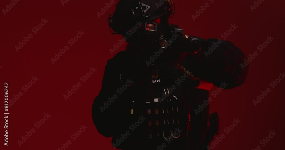 A special forces operative aiming an AR-15 rifle, depicted in a male portrait against a red background with flashes around. A special forces operative aiming an AR-15 rifle, depicted in a male portrait against a red background with flashes around.