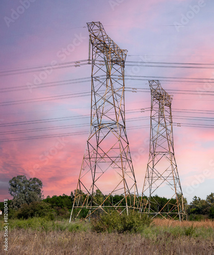 Electricity pylon against a pink sky.  Photographed inside Rietvlei Nature Reserve, Gauteng, South Africa.