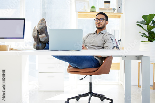 Laptop, desk and feet on table for businessman, relax and thinking in office. Planning, company and manager or ceo is workplace for brainstorm, web designer and executive for professional male person