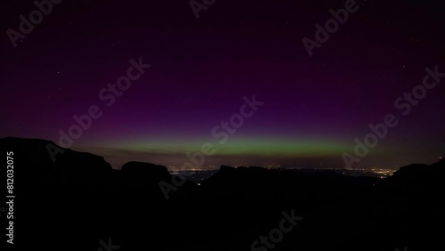 Aurora Borealis time lapse Stars Over Mountains of Switzerland in the canton of Appenzell. The Northern Lights are usually found in Scandinavian countries such as Norway, Sweden or Finland. 4K. photo