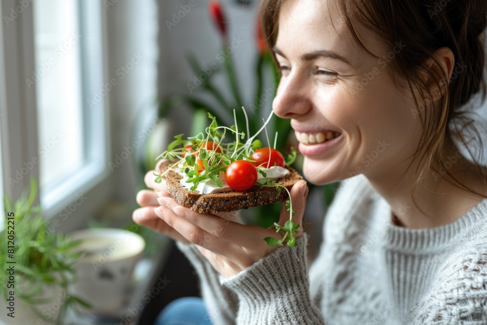 Healthy Eating Bread. Smiling Woman Enjoying Rye Crisp Bread with Creamy Vegan Cheese and Fresh Cherry Tomato Healthy Eating Bread. Smiling Woman Enjoying Rye Crisp Bread with Creamy Vegan Cheese and Fresh Cherry Tomato