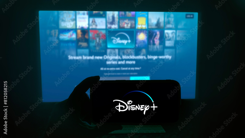 Disney+ app running on a modern mobile phone. The smartphone is being ...