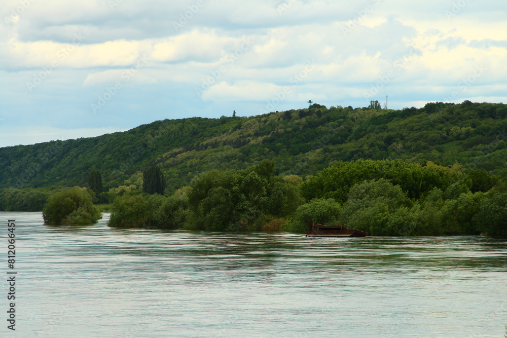 A body of water with trees on the side A body of water with trees on the side