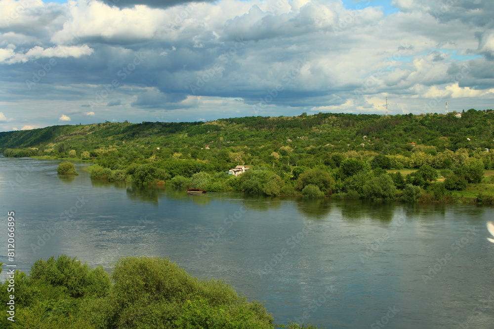 A body of water with trees on the side A body of water with trees on the side