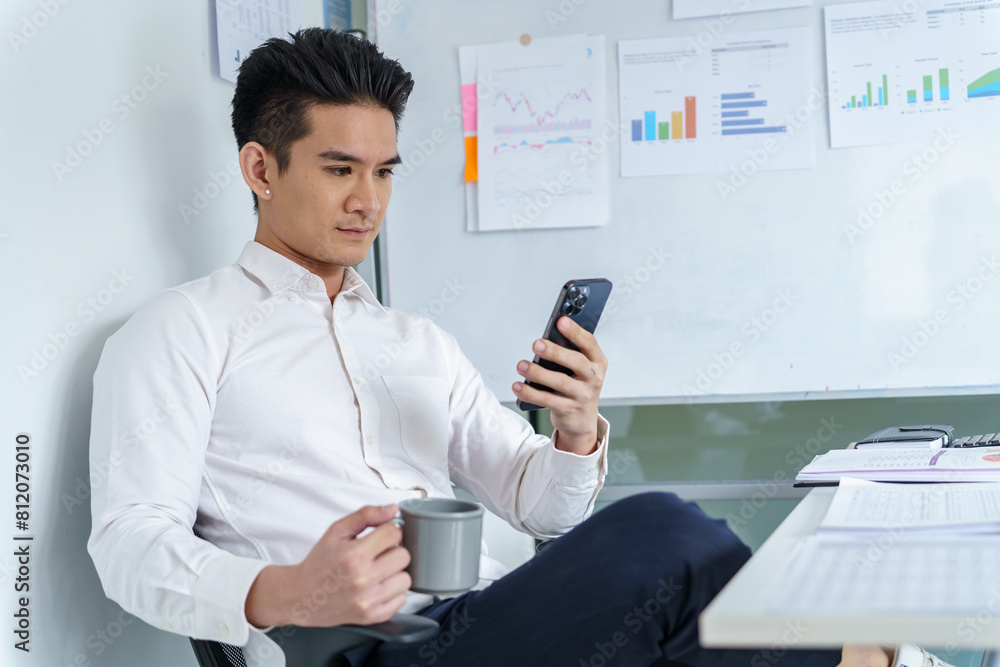 Asian Business man working with laptop. Young business man thinking Concentrated at work Asian Business man working with laptop. Young business man thinking Concentrated at work
