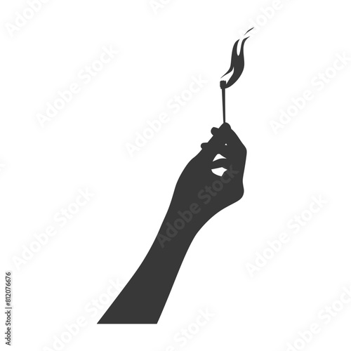 Silhouette hand holding burning match black color only