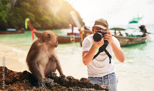 Photography Man, camera and monkey with holiday, beach and tropical island with getaway trip, Bali and tourism