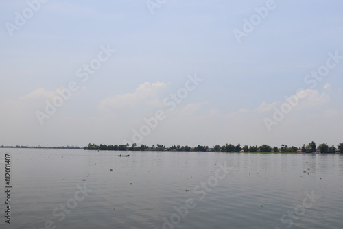 Small fishing boat and island in lake