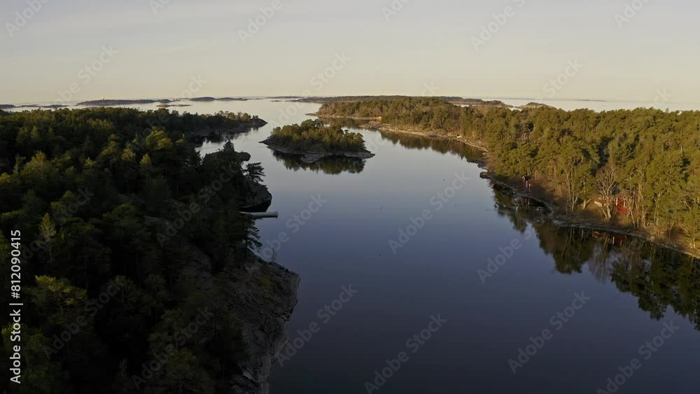 Explore a stunning, vast body of water tucked away in a serene forest, enveloped by towering trees and vibrant foliage Explore a stunning, vast body of water tucked away in a serene forest, enveloped by towering trees and vibrant foliage