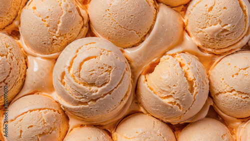 Creamy Orange Gelato Scoops on Display. Close-up of freshly scooped pistachio gelato arranged neatly, showcasing their texture and color. Ice cream balls, background.