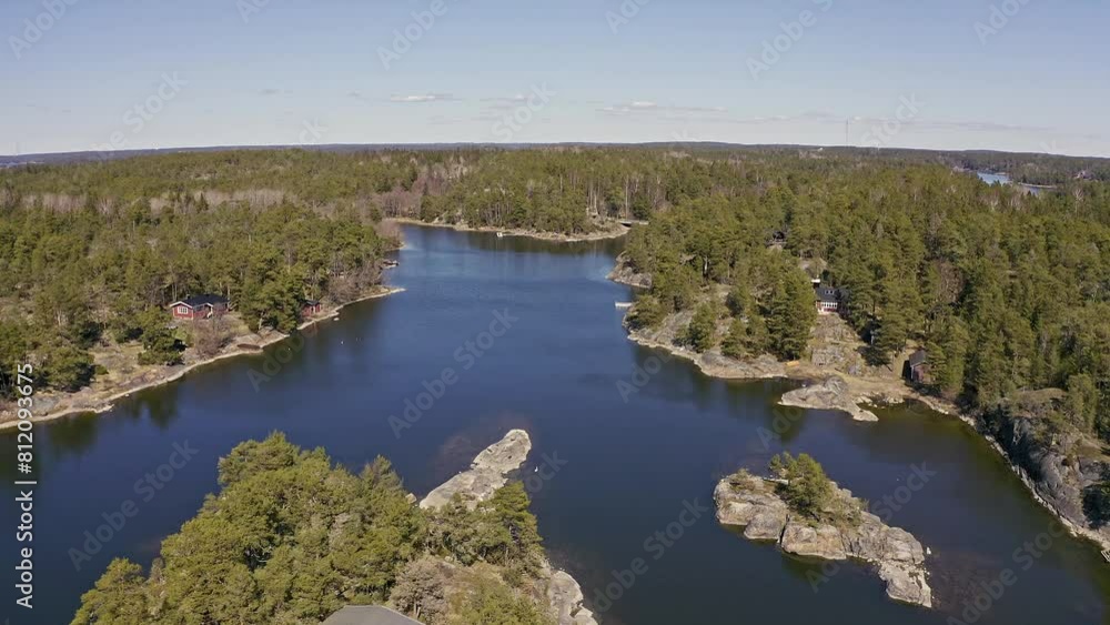 Explore a tranquil lake nestled in a dense forest from above, surrounded by lush green trees and teeming with pristine beauty Explore a tranquil lake nestled in a dense forest from above, surrounded by lush green trees and teeming with pristine beauty