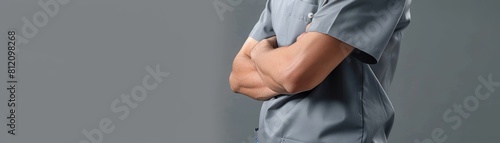 Highresolution image of a healthcare workers torso, wearing navy blue scrubs, emphasizing functionality and professionalism © kitidach