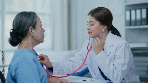 Doctor examining old lady patient in retired life  by listening lungs and breathing for Acute Respiratory Illness Clinic in hospital nursing home aged care by using health and life insurance planning photo