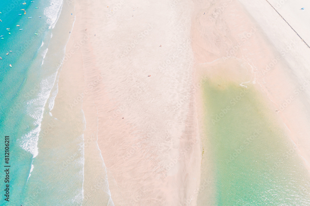 Fototapeta premium people on the shore of a beach enjoying the summer, aerial top view with a drone.