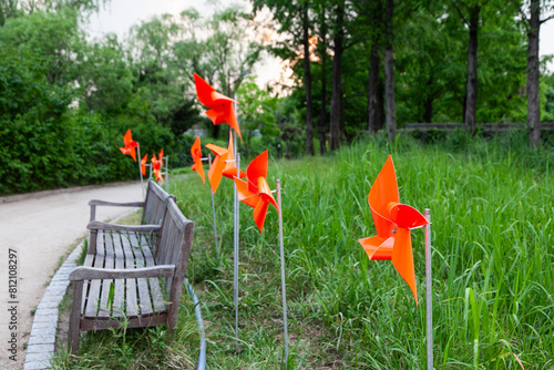 Photography View of the pinwheels and wooden benches in the park