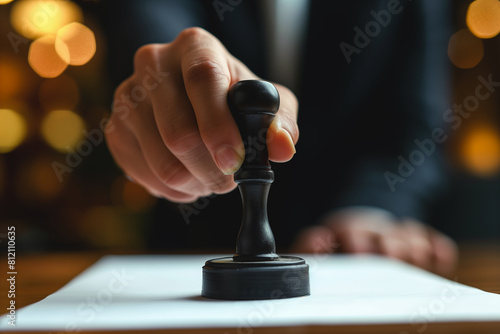 Businessman using rubber stamp on official document, close-up shot in office setting ,generative ai