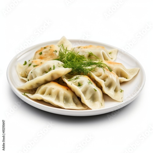 Dumplings with greens and dill on white plate, Dumplings with greens on plate.