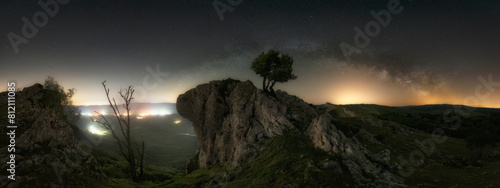 panoramic view of the Milky Way the Portupekoleze arch in the Urbasa Natural Park, Navarra with a starry sky photo