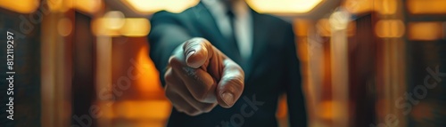 Close-up of businessman pointing finger at camera. photo