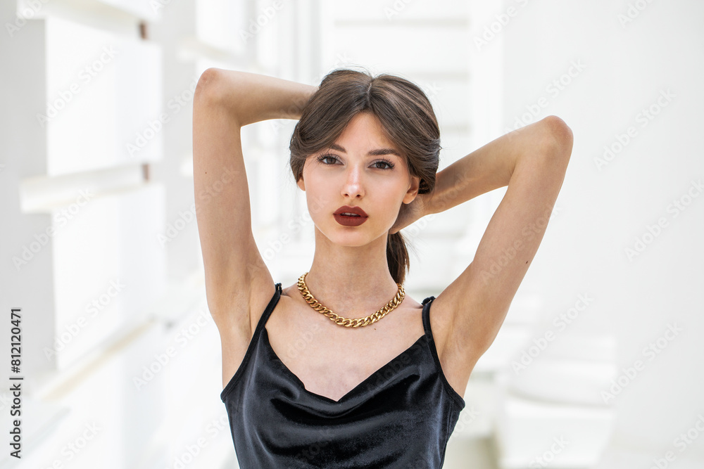 Portrait of a young girl in a long black evening dress Portrait of a young girl in a long black evening dress