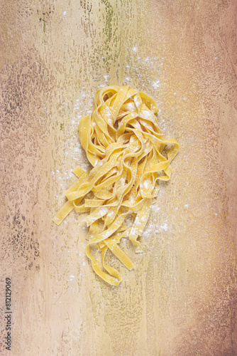 raw tagliatelli pasta , homemade, top view, no people, rustic, food concept, photo