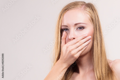 Shocked woman covering her mouth with hand