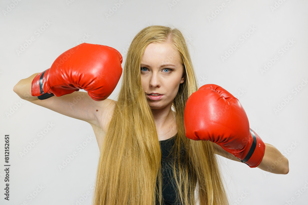 Woman in gloves playing sports boxing Woman in gloves playing sports boxing