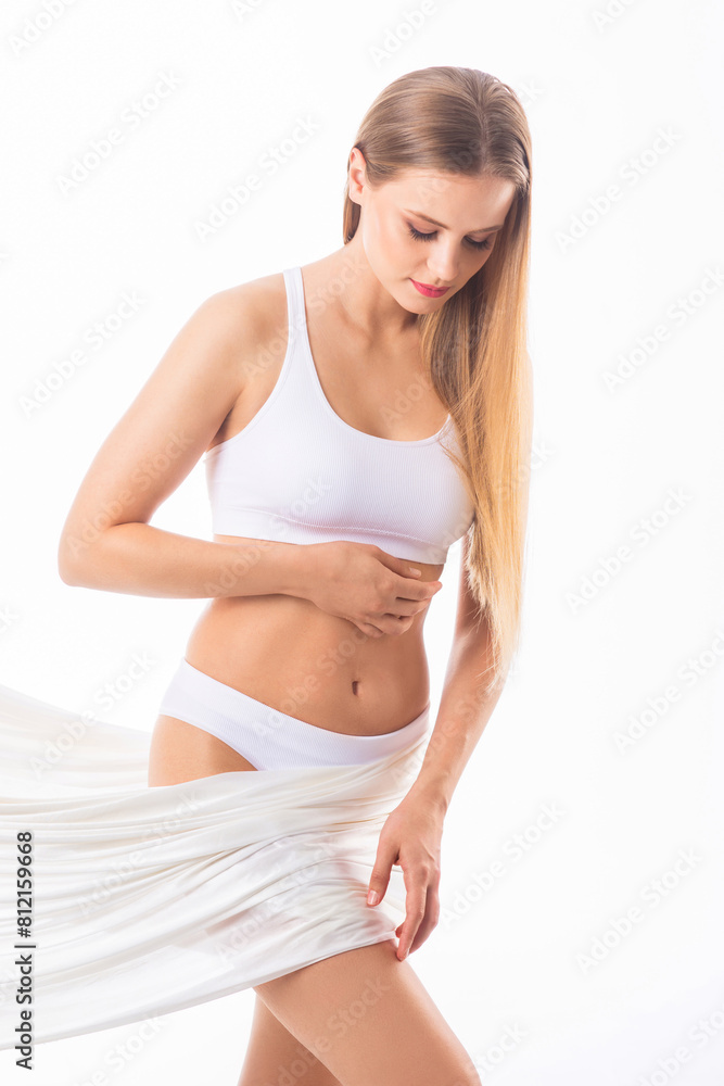 Young, fit and beautiful blond woman in white swimsuit isolated on grey background. Healthcare, diet, sport and fitness concept. Young, fit and beautiful blond woman in white swimsuit isolated on grey background. Healthcare, diet, sport and fitness concept.