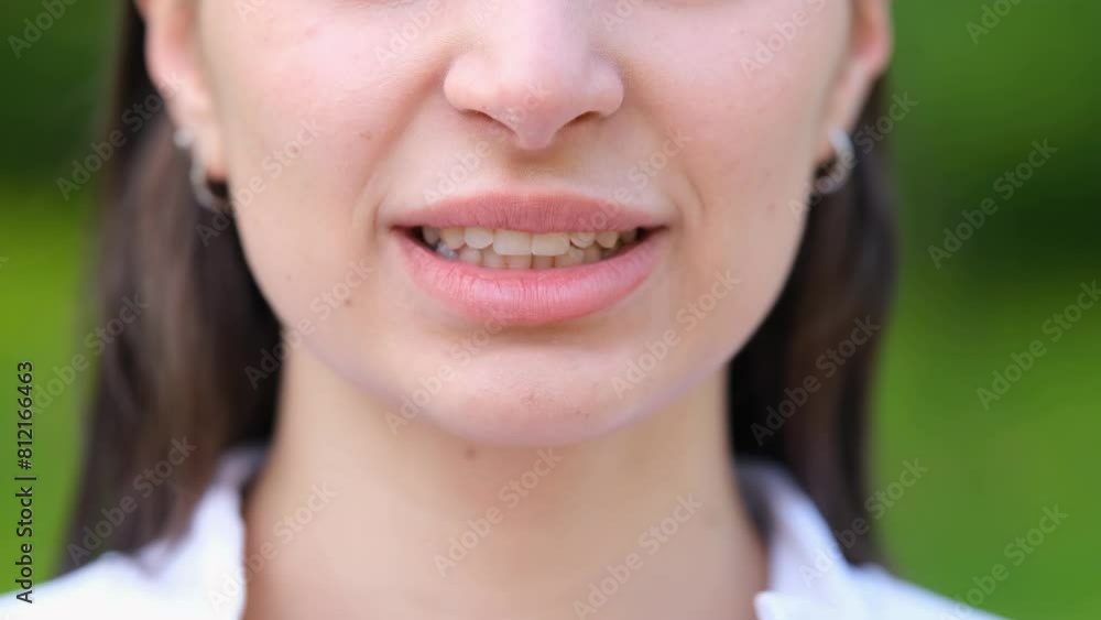 Portrait of a girl, close-up of lips. The girl smiles. The emotion of joy. Portrait of a girl, close-up of lips. The girl smiles. The emotion of joy.