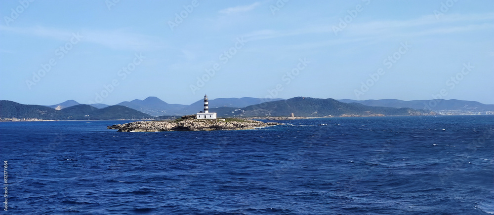 Obraz premium mediterranean lighthouse in a island between ibiza and formentera