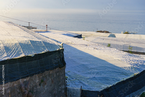 Plastic greenhouses on coast, Spain