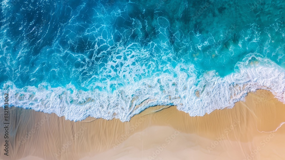 Captivating aerial view of a beach with clear blue water and gentle waves, setting a perfect scene for relaxing summer vacation backgrounds