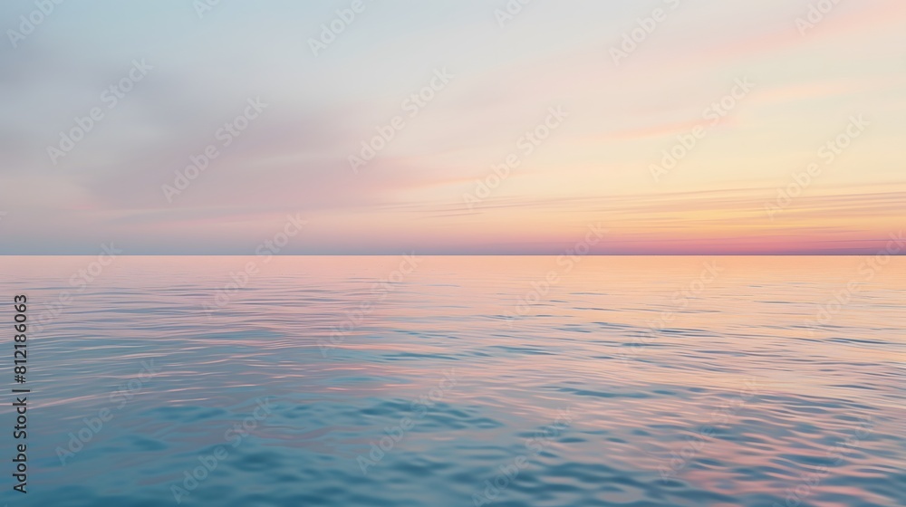 Fototapeta premium Dreamy sunset over a calm ocean with pastel hues