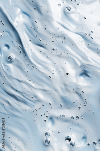The image is of a blue liquid with many small bubbles in it