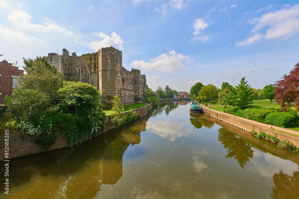 Castle ruins next to a peaceful river Castle ruins next to a peaceful river