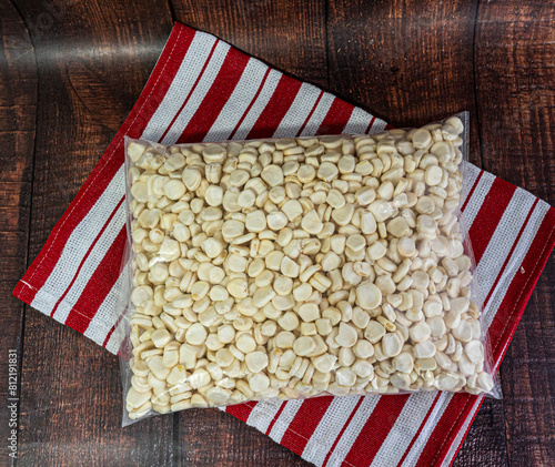 bag of peruvian corn kernels on a rustic wooden background