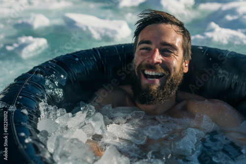A man using an ice plunge pool bath for recovery after sports exercise
