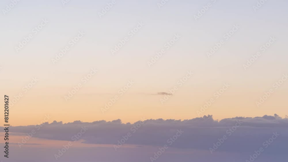 Time-lapse of the sunrise, as the sun struggles to peek through the clouds and its rays spread in all directions, painting the sky in bright warm colors. Time-lapse of the sunrise, as the sun struggles to peek through the clouds and its rays spread in all directions, painting the sky in bright warm colors.