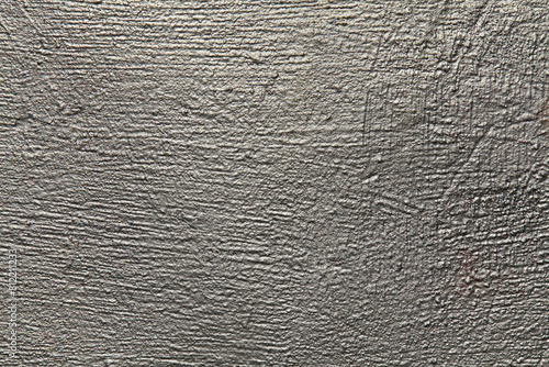 Silver metallic wall, background, texture. Uneven, grooved and embossed silvery backdrop. Grey surface with silver porous color. Abstract, lumpy and textured surface. Vintage blanch sketches. Platinum photo