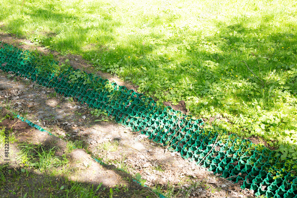 Fototapeta premium Strengthening of the soil from collapse.A special mesh for strengthening the soil.
