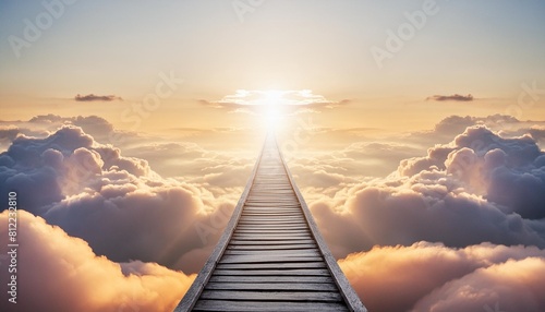 concept of a path winding through the clouds ending at a brilliant light in the distance it symbolizes heaven afterlife a near death experience or simply the path to a goal and bright future © Susan