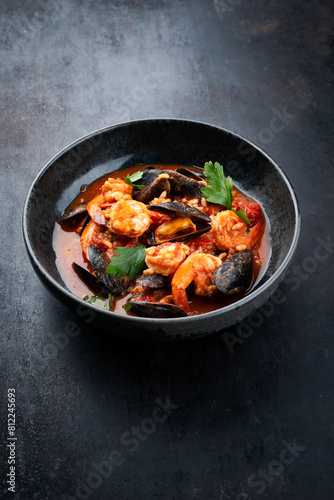 Traditional Creole cajun court bouillon with rice, mussels and prawn gumbo chowder stew as close-up in a bowl