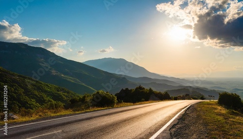 road in mountains kalabaka region meteora greece empty asphalt road with glowing perfect sky and sunlight landscape with beautiful winding mountain road with a perfect asphalt in the evening © Makayla