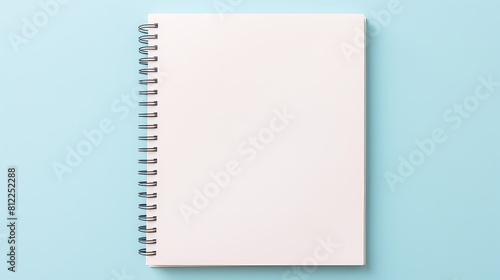 A spiral bound notebook with a blue background