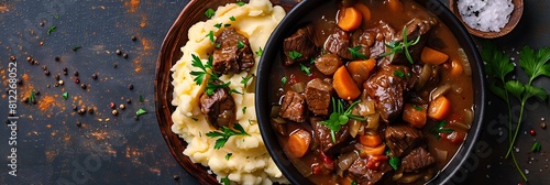 Slow cooker beef bourguignon with mashed potatoes, top view horizontal food banner with copy space photo