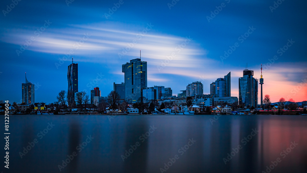 Vienna Skyline at Dusk, Reflective Danube Waters and Modern Cityscape