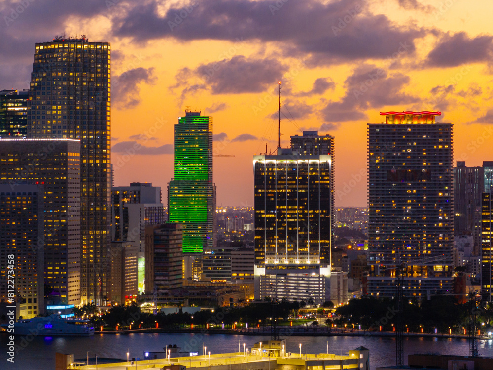 Obraz premium Buildings of Downtown Miami on an orange sunset sky