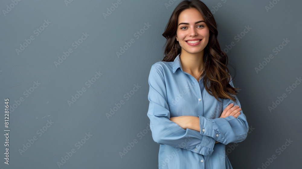 Happy young smiling confident professional business woman wearing blue shirt, pretty stylish female executive looking at camera, standing arms crossed isolated on gray background