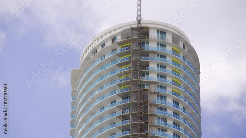 HDR video tower construction with cranes on blue sky photo