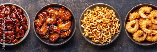chinese food - sweet and sour chicken, fried shrimp, noodles, and beans photo